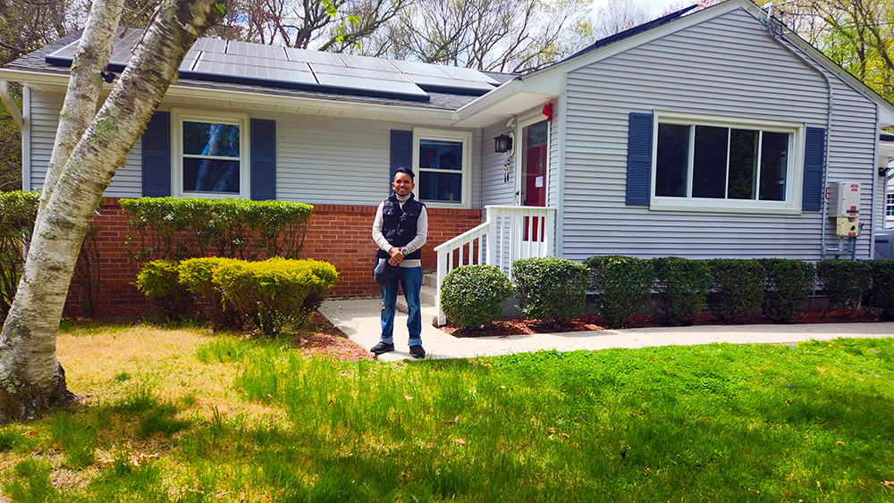 Image: picture of me posing in front of the house we bought