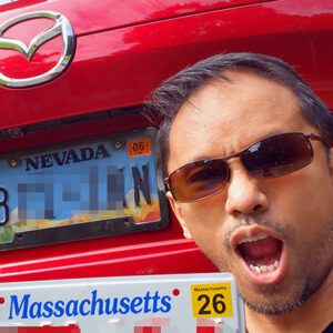 Image: me holding MA licence plate