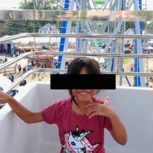 Image: Daughter in a big wheel