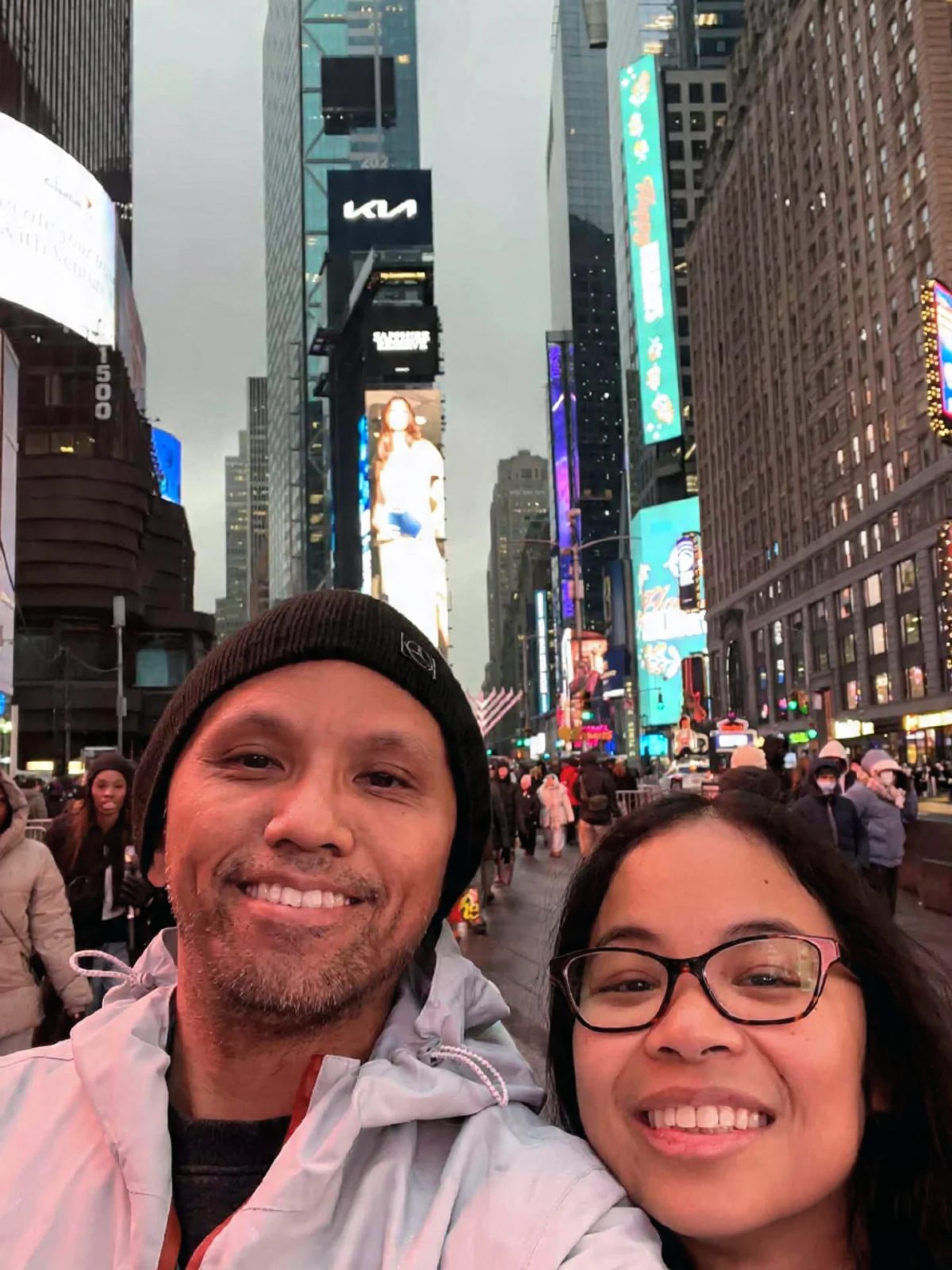 image: couple holiday at Times Square, 2025.